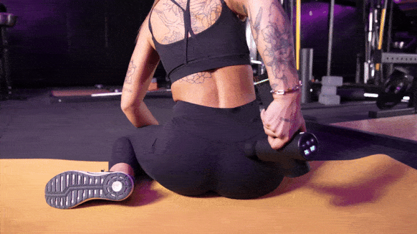 Masážní pistole na spodní záda Masážní pistole na spodní záda